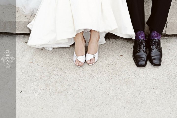 Here past client of The Wedding Planners, Peter, shows off his purple socks.  Photo by 