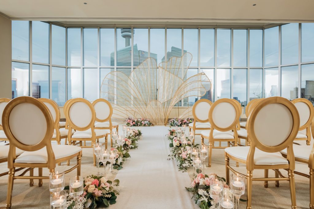 Luxury wedding ceremony set up in front of view of the CN Tower.