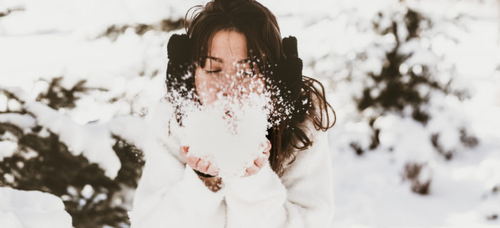 woman blowing snow