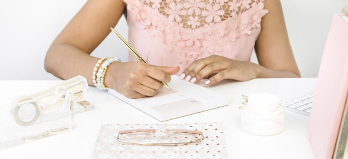 Woman writing in notebook