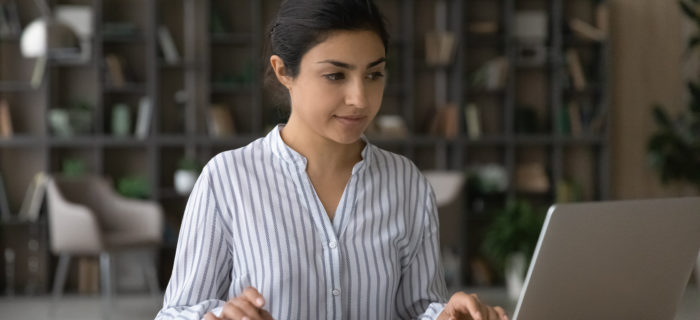 female professional working on calculator