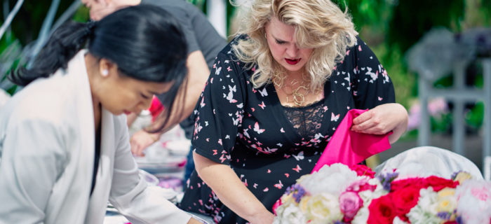 wedding planners setting up a table at wedding