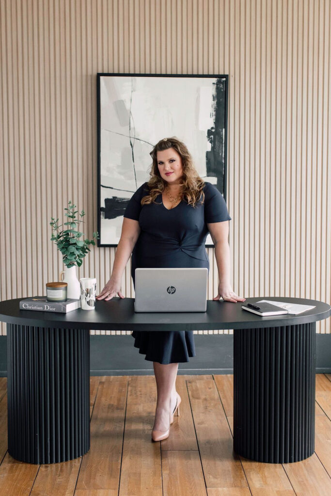 Danielle Andrews, president of WPIC standing behind laptop