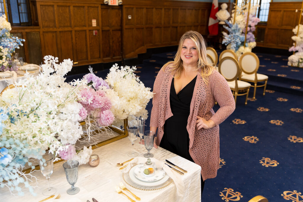 A wedding planner setting up a reception room