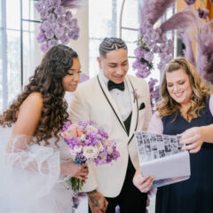Wedding planner with bride and groom at wedding