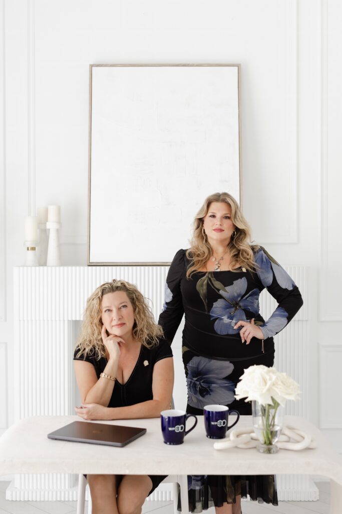 Tracey and Danielle, co-founders of WPIC in office at desk