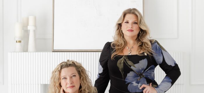 Tracey and Danielle, co-founders of WPIC in office at desk