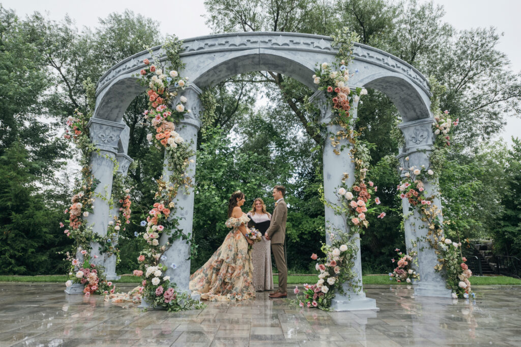 a Grecian-inspired wedding ceremony with arches