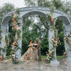 a Grecian-inspired wedding ceremony with arches