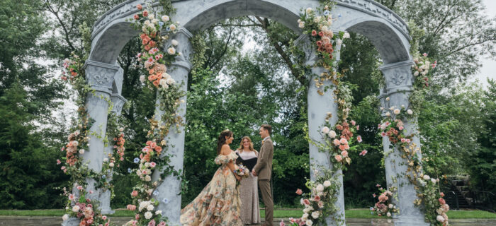 a Grecian-inspired wedding ceremony with arches