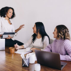 wedding planners in a meeting planning a last minute wedding.