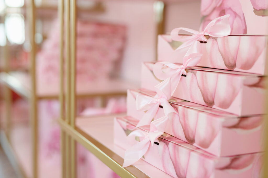 pretty pink boxes lined up and stacked in office.